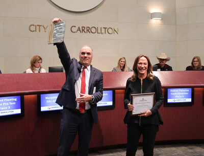 Carrollton, Texas, mayor Steve Babick and Tech Safety Lines CEO Diane Waghorne celebrate the company winning the first-ever Mayor’s Spotlight Award. (Courtesy Tech Safety Lines)