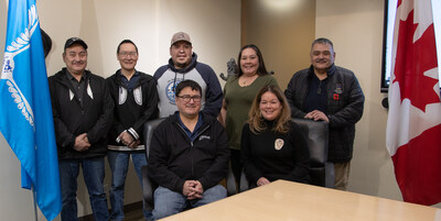 Representatives from six communities celebrate the announcement of Inuvialuit-led infrastructure that will support a more reliable and affordable energy supply. (Back row from left to right): John Lucas Jr., Sachs Harbour Community Corporation; Colin Okheena, Ulukhaktok Community Corporation; Jordan McLeod, Aklavik Community Corporation; Melinda Gillis, Inuvik Community Corporation; Darrel Nasogaluak, Tuktoyaktuk Community Corporation. (Front row): Duane Smith (Chair and CEO, Inuvik Regional Corporation) and Hillary Thatcher (Canada Infrastructure Bank). (CNW Group/Canada Infrastructure Bank)