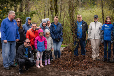 PGE volunteers and a newly-planted tree at a Friends of Trees event