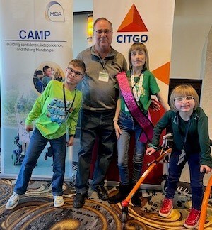 James Cristman, CITGO Vice President and General Manager, Lemont Refinery, with MDA Ambassadors Summer Nagele, Holly Szymczak, and Joshua Szymczak